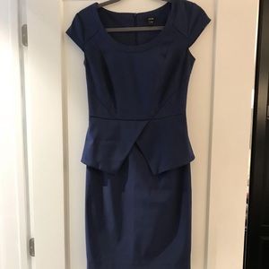 Knee length office dress with peplum